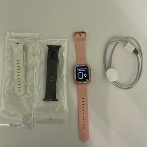 Rose Gold 40MM Apple Watch SE with charger and two bands.